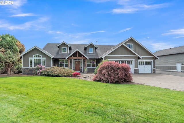 26250 S Milk Creek Cir, Mulino, OR 97042 - craftsman-style home featuring stone siding, board and batten siding, concrete driveway, and a front lawn
