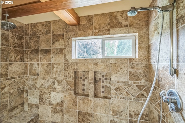 bathroom with a tile shower