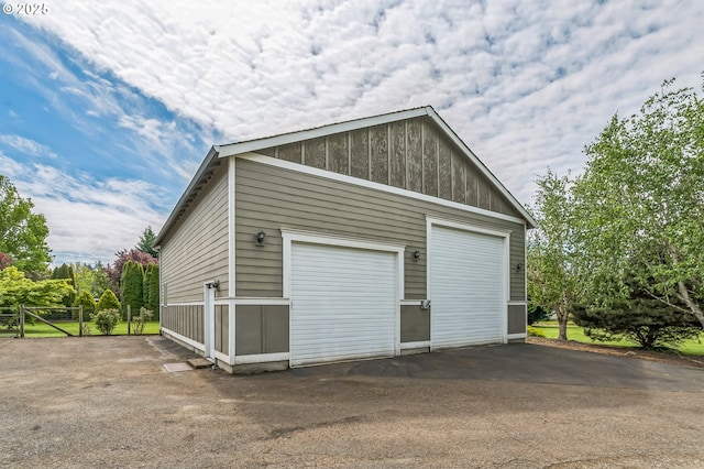 detached garage with fence