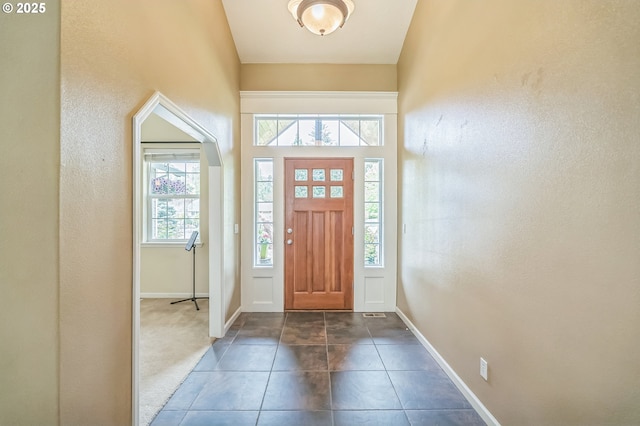 26250 S Milk Creek Cir, Mulino, OR 97042 - entrance foyer with plenty of natural light, baseboards, a textured wall, and dark tile patterned flooring