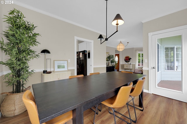 7297 Holly St, Springfield, OR 97478 - dining space featuring wood finished floors and ornamental molding
