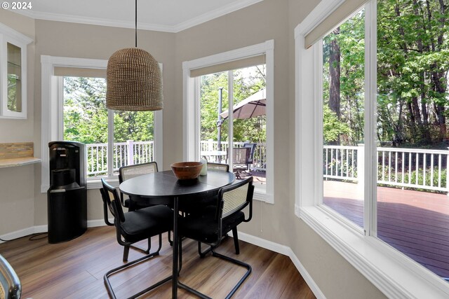 7297 Holly St, Springfield, OR 97478 - dining space featuring wood finished floors, healthy amount of natural light, and ornamental molding