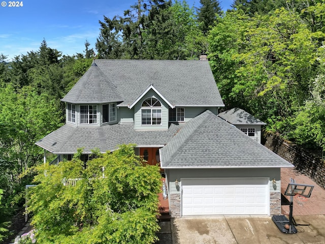 7297 Holly St, Springfield, OR 97478 - view of front of property with roof with shingles, stone siding, concrete driveway, and an attached garage