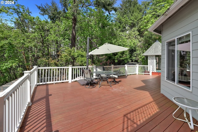 7297 Holly St, Springfield, OR 97478 - wooden terrace featuring outdoor dining space and view of wooded area