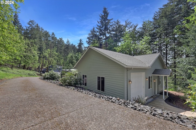 7297 Holly St, Springfield, OR 97478 - view of property exterior featuring roof with shingles