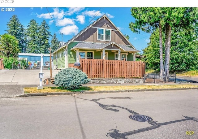 10387 N Mohawk Ave, Portland, OR 97203 - view of front of home featuring board and batten siding and covered porch