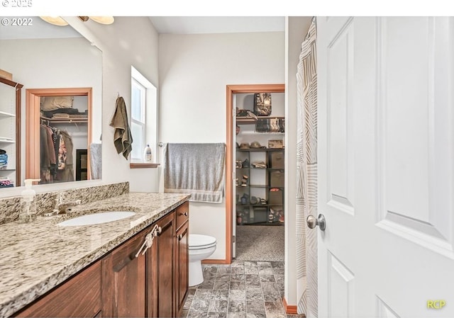 10387 N Mohawk Ave, Portland, OR 97203 - full bath featuring vanity, toilet, and a spacious closet