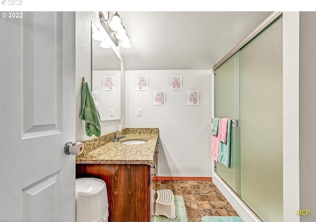 10387 N Mohawk Ave, Portland, OR 97203 - bathroom with a shower stall, vanity, toilet, and baseboards