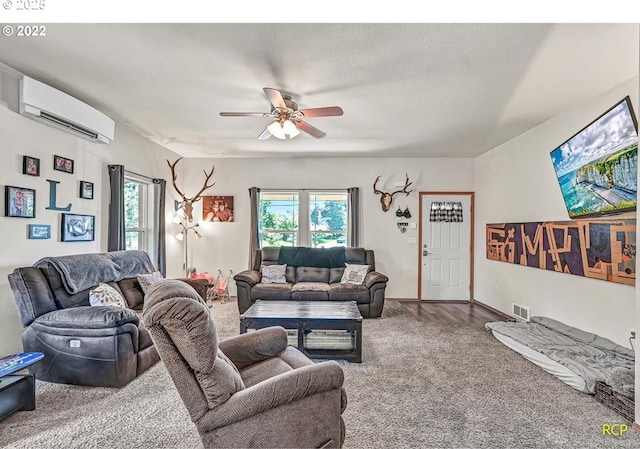 10387 N Mohawk Ave, Portland, OR 97203 - carpeted living room with a wall unit AC, a ceiling fan, and healthy amount of natural light