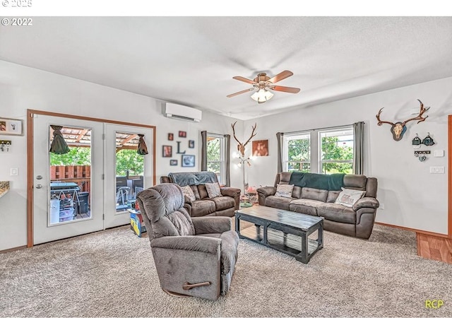 10387 N Mohawk Ave, Portland, OR 97203 - carpeted living area with a wall mounted air conditioner, a ceiling fan, and baseboards