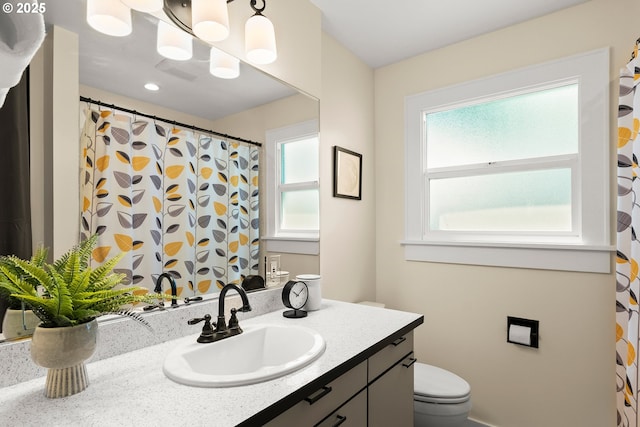 226 N Highland St, Portland, OR 97217 - full bathroom featuring vanity, toilet, and a shower with curtain