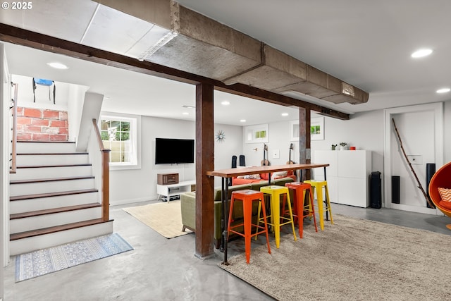226 N Highland St, Portland, OR 97217 - bar featuring concrete flooring, recessed lighting, and stairway