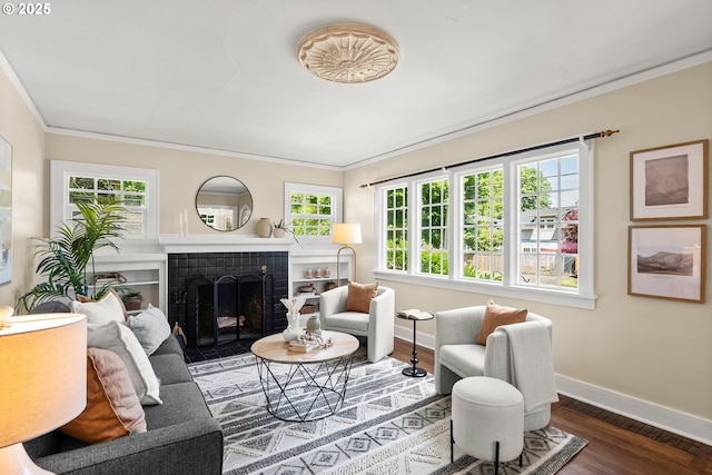 226 N Highland St, Portland, OR 97217 - living area with ornamental molding, baseboards, a fireplace, and wood finished floors