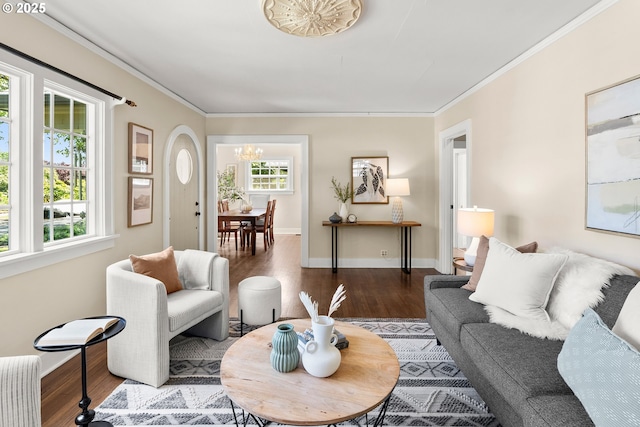 226 N Highland St, Portland, OR 97217 - living room with a chandelier, wood finished floors, crown molding, radiator heating unit, and baseboards