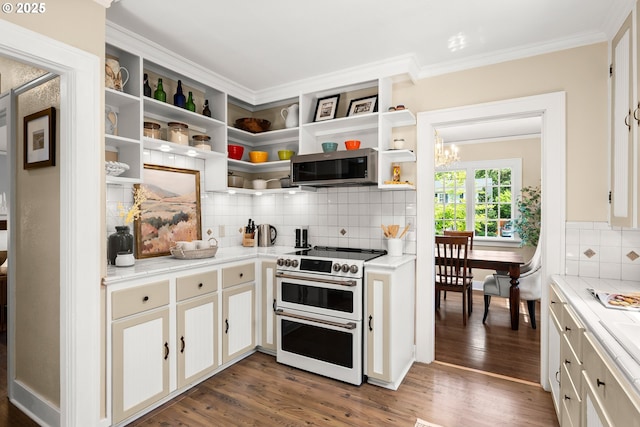 226 N Highland St, Portland, OR 97217 - kitchen with double oven range, stainless steel microwave, open shelves, tasteful backsplash, and light countertops