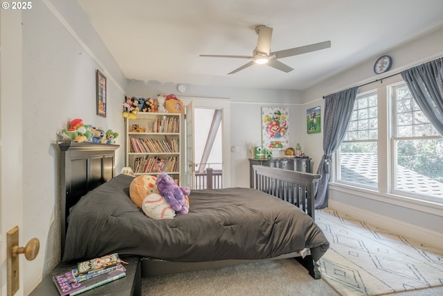 bedroom with baseboards and a ceiling fan