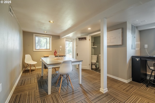 carpeted dining area featuring visible vents, electric panel, baseboards, and recessed lighting