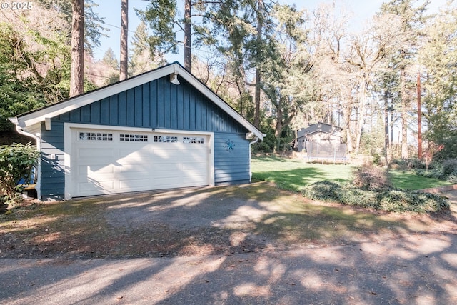 detached garage featuring a trampoline