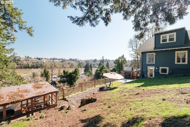 view of yard featuring fence and a patio