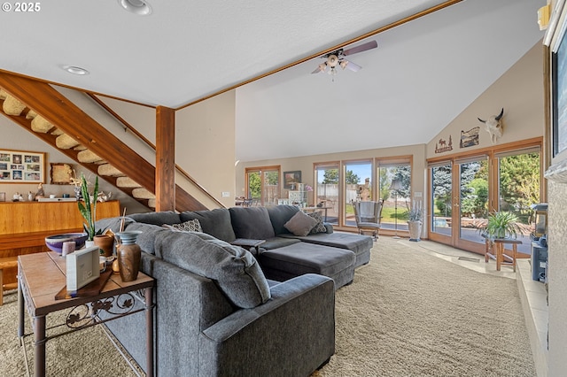 living room with recessed lighting, high vaulted ceiling, stairs, and ceiling fan