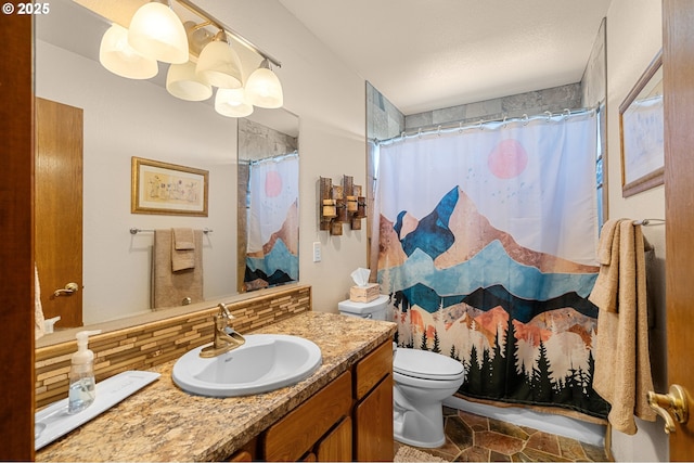 full bathroom featuring toilet, vanity, and curtained shower