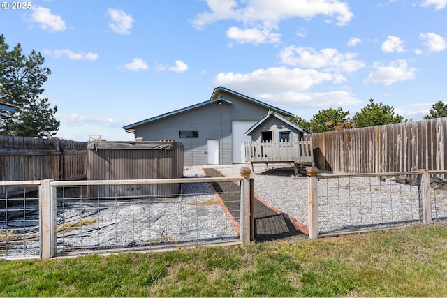 view of side of property with a fenced backyard and a deck