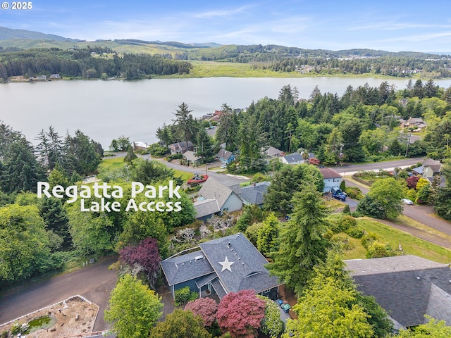 1626 NE Regatta Way, Lincoln City, OR 97367 - aerial view of a nearby body of water and a heavily wooded area