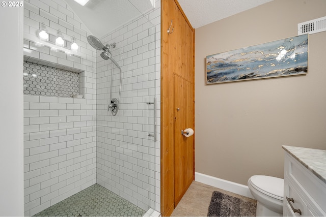 1626 NE Regatta Way, Lincoln City, OR 97367 - bathroom with a shower stall, vanity, toilet, tile patterned flooring, and vaulted ceiling