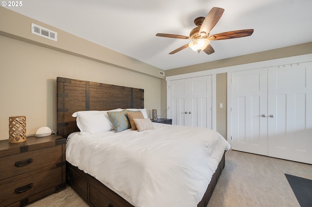 1626 NE Regatta Way, Lincoln City, OR 97367 - bedroom with multiple closets and a ceiling fan