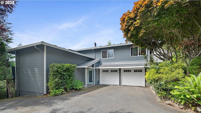 1626 NE Regatta Way, Lincoln City, OR 97367 - view of front of home with asphalt driveway and a garage