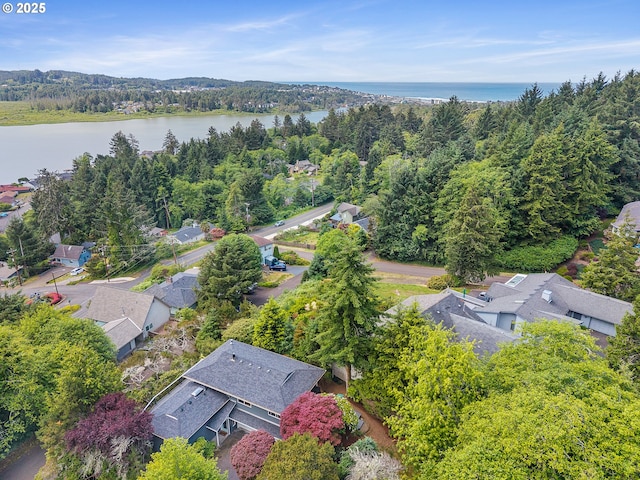 1626 NE Regatta Way, Lincoln City, OR 97367 - aerial perspective of suburban area with a nearby body of water and a heavily wooded area