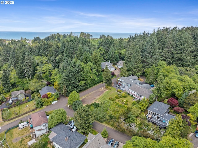 1626 NE Regatta Way, Lincoln City, OR 97367 - aerial view of residential area featuring a large body of water and a forest
