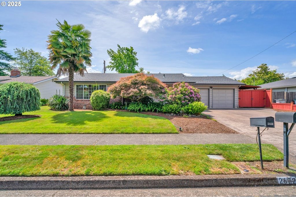 2672 Cheryl St, Eugene, OR 97408 - ranch-style home featuring concrete driveway, a garage, a front yard, and brick siding