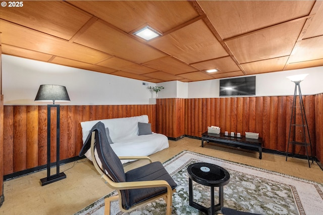 sitting room with a wainscoted wall and wood walls