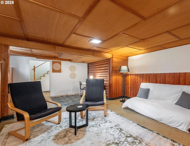 sitting room with washer / clothes dryer, rustic walls, wooden ceiling, wood walls, and stairs