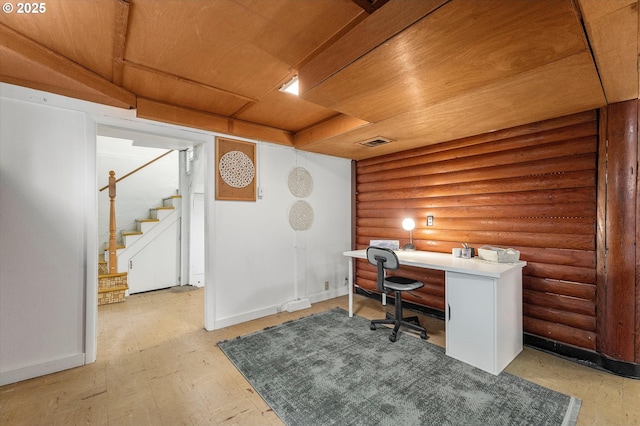 office with rustic walls, visible vents, wood ceiling, and baseboards