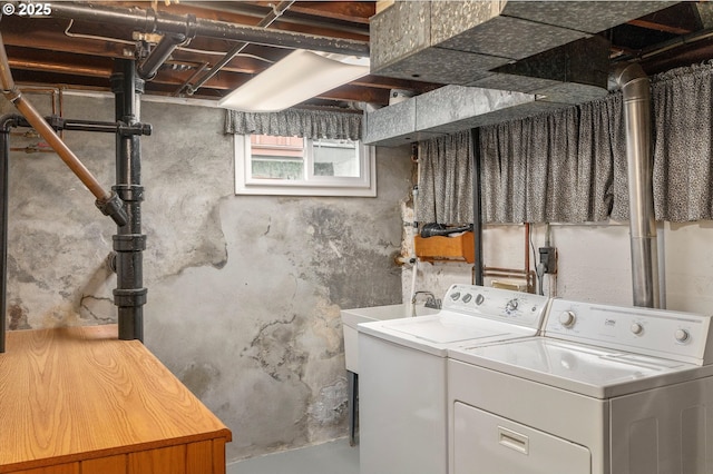 laundry room with washer and clothes dryer and laundry area