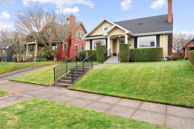 view of front of house featuring a front yard and a chimney