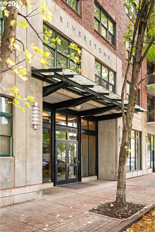 view of exterior entry featuring french doors