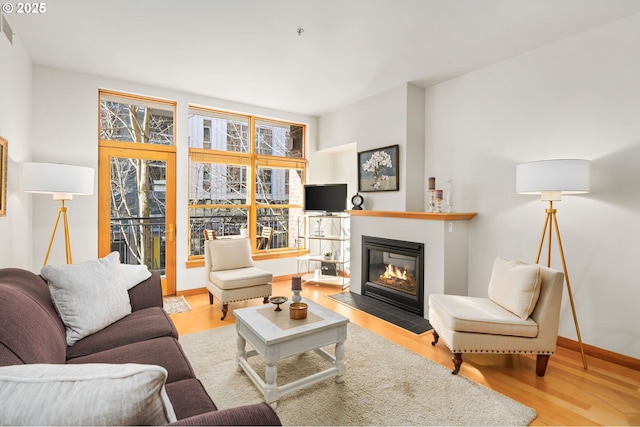 living room with light hardwood / wood-style flooring