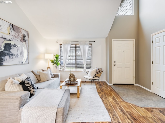 living room with lofted ceiling and hardwood / wood-style flooring