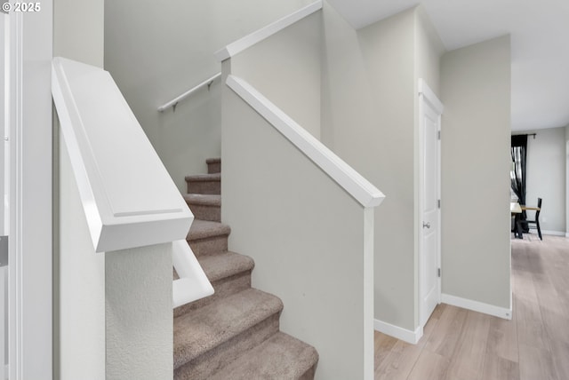 stairway with wood-type flooring