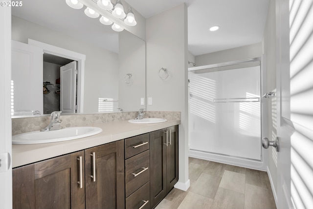 bathroom with vanity and walk in shower