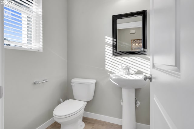 bathroom with toilet and sink