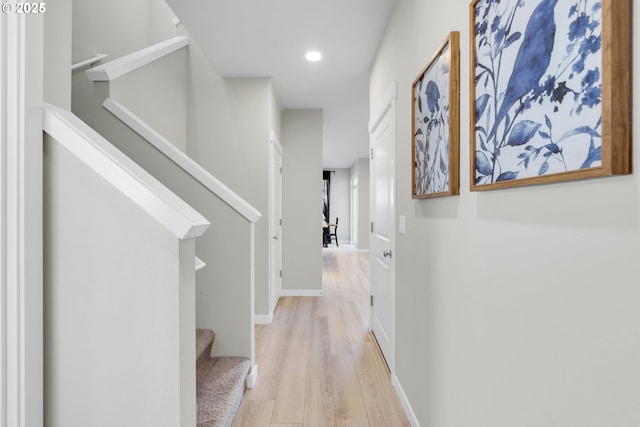 hall with light hardwood / wood-style flooring