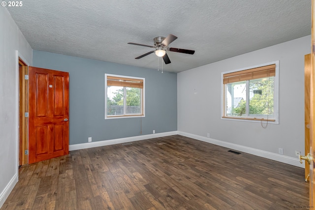 35538 SE Snuffin Rd, Estacada, OR 97023 - spare room featuring dark wood-style floors, ceiling fan, a textured ceiling, and baseboards