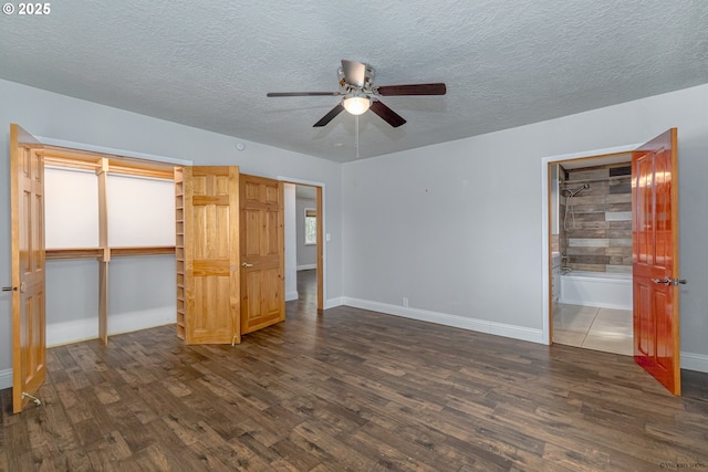 35538 SE Snuffin Rd, Estacada, OR 97023 - unfurnished bedroom with dark wood-style floors, a textured ceiling, baseboards, a closet, and ceiling fan