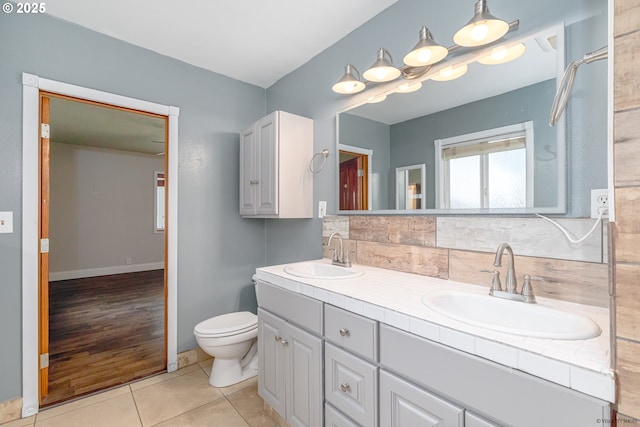 35538 SE Snuffin Rd, Estacada, OR 97023 - bathroom with double vanity, toilet, tasteful backsplash, and tile patterned flooring