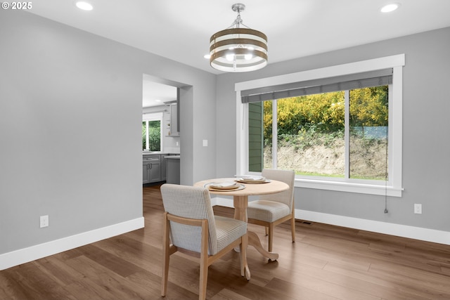 35681 Bella Ridge Loop, Astoria, OR 97103 - dining room featuring baseboards, a chandelier, recessed lighting, and dark wood-style floors