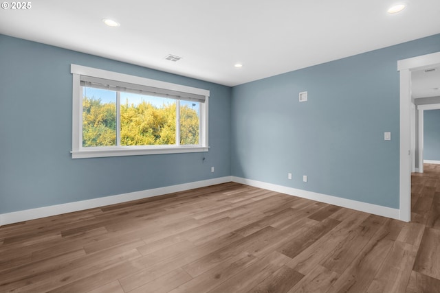 35681 Bella Ridge Loop, Astoria, OR 97103 - empty room featuring wood finished floors, baseboards, and recessed lighting